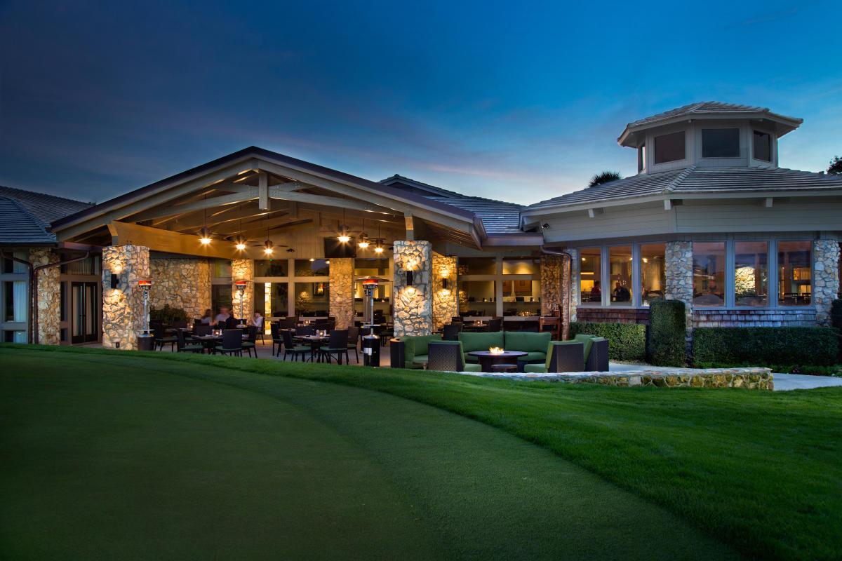 Arnold Palmer's Bay Hill country club with an outdoor seating area alongside a fire pit