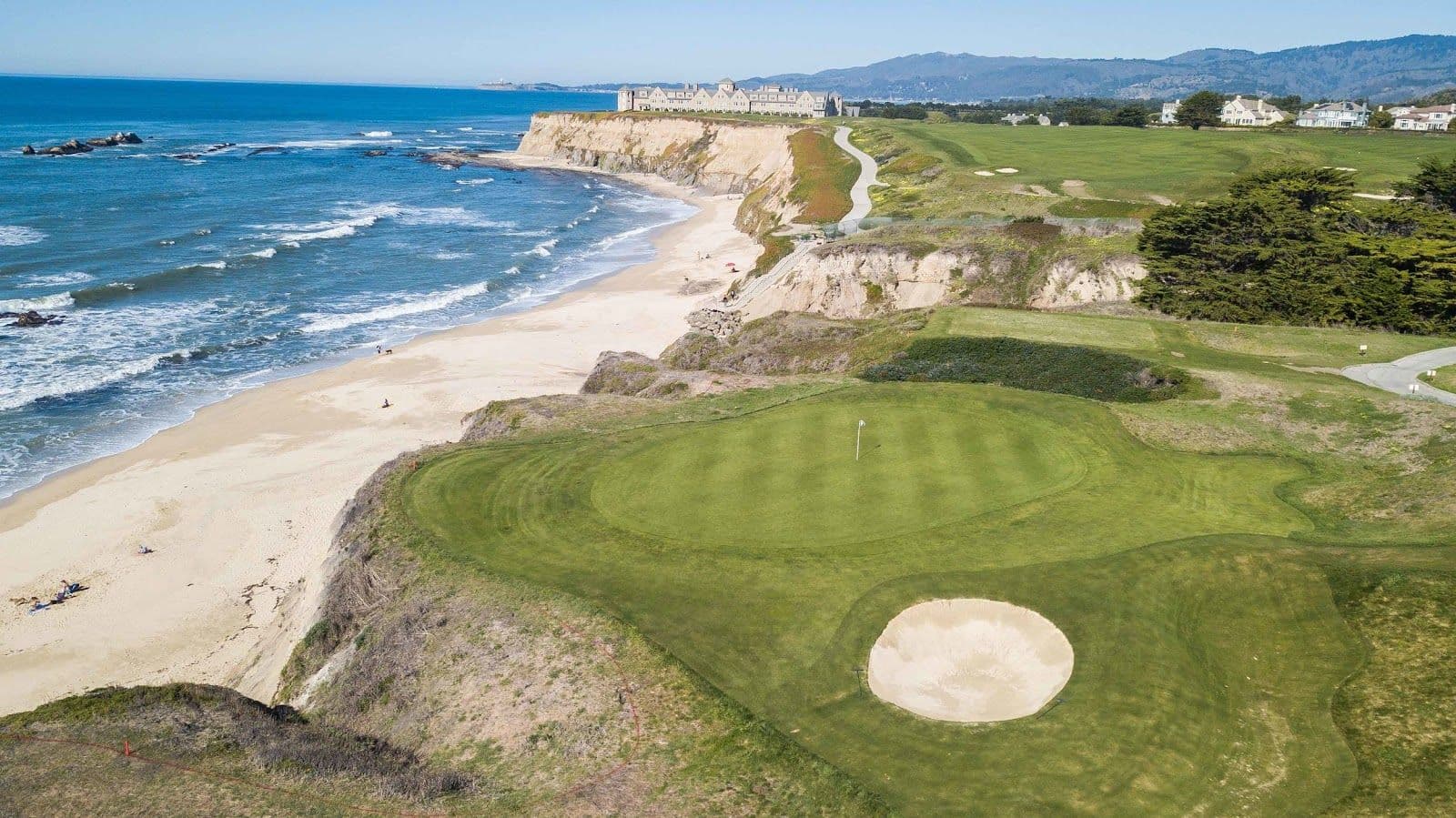 A coastal green with a sand bunker