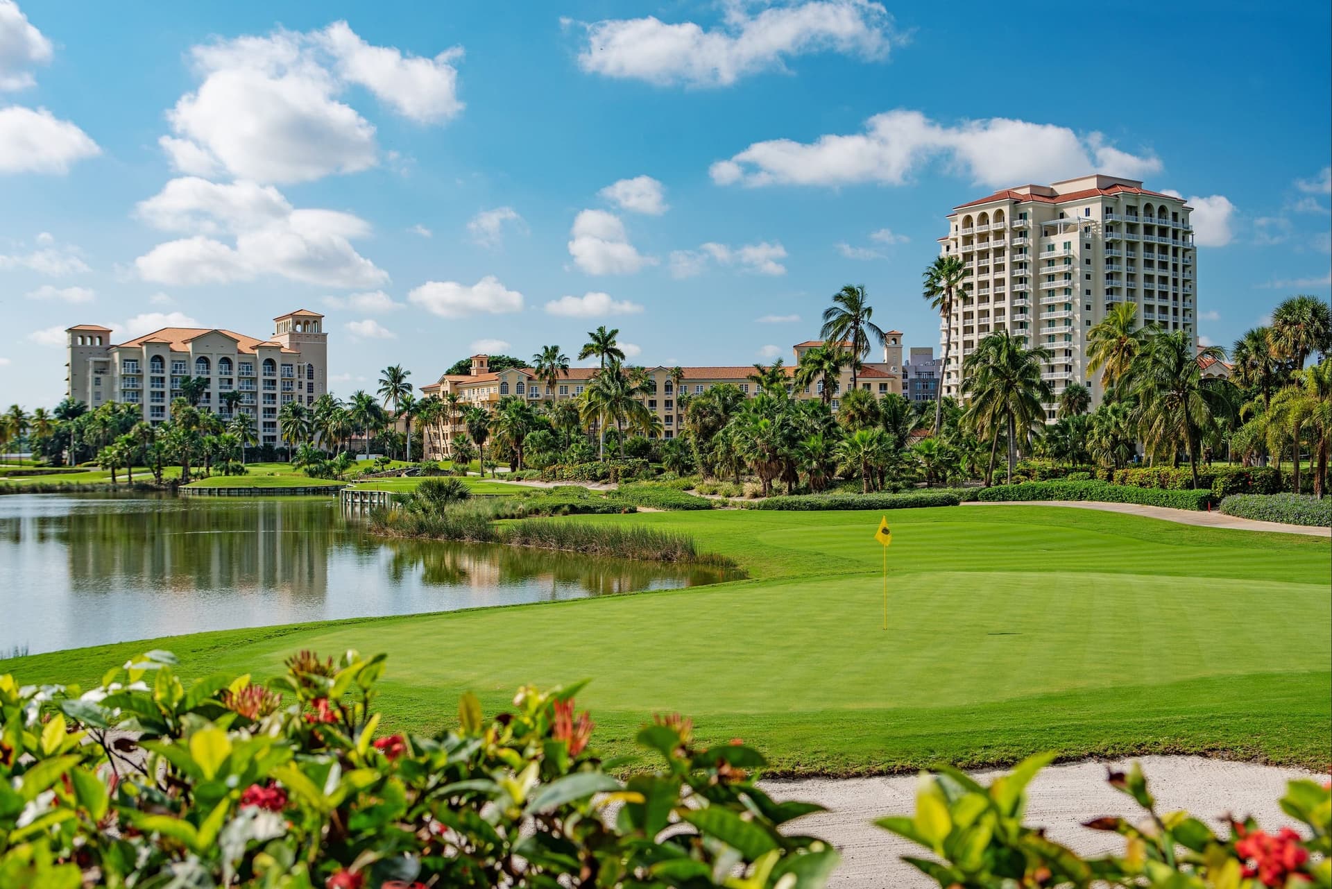 The resort building looking over balm trees and the on sight course