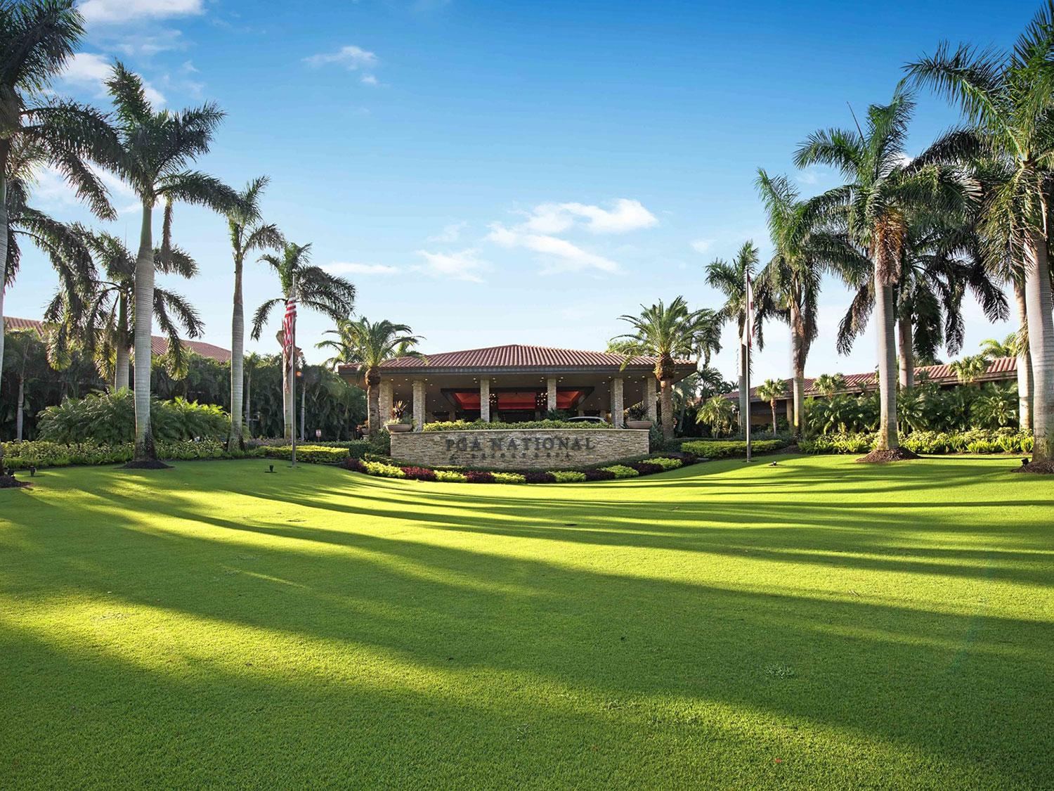 Palm trees leading to the grand entrance at the PGA National Resort