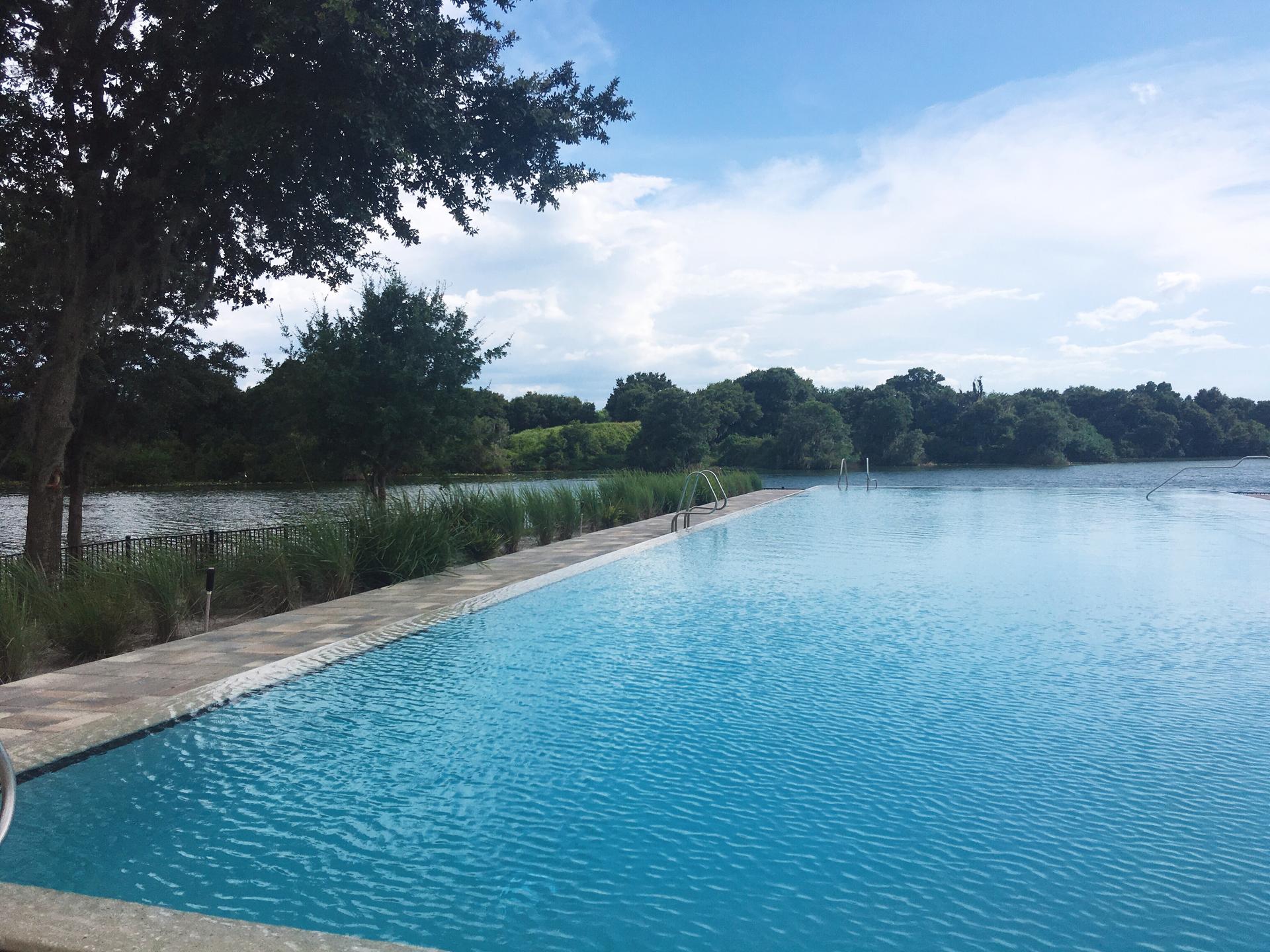 Large infinity pool at the Streamsong resort leading to the local lake