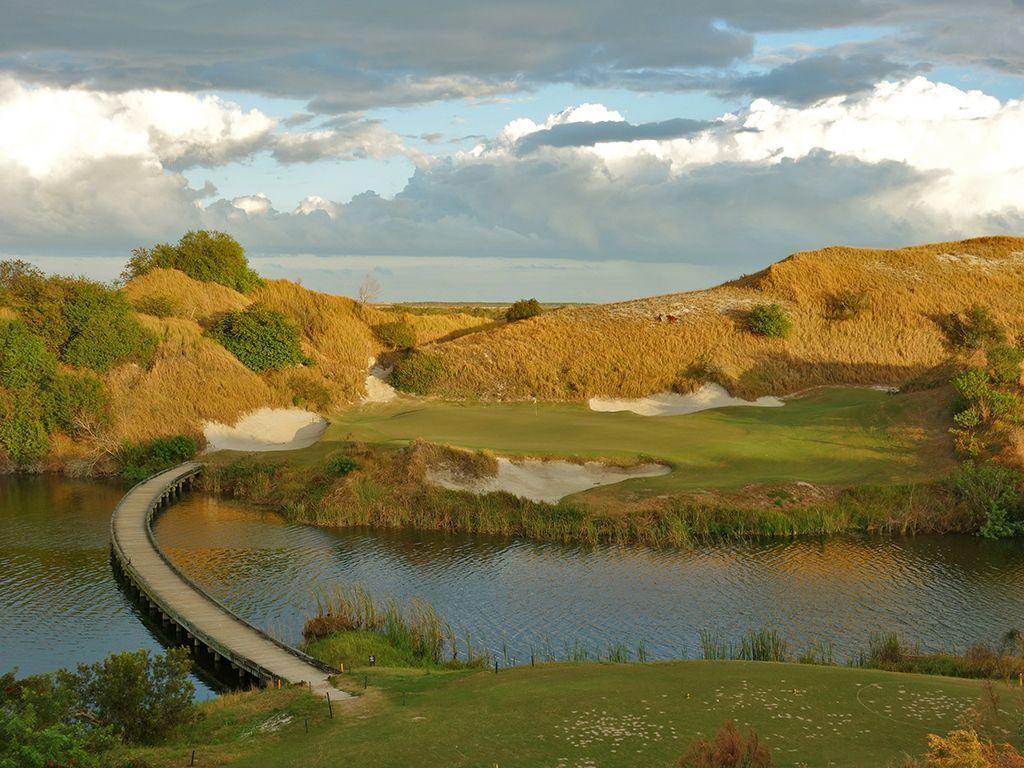 Green nestled among sandy dunes and dramatic landscapes.