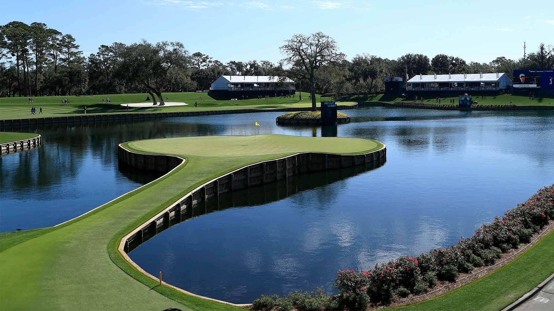 Golfers enjoying their round at The Players Stadium Course in front of spectator booths