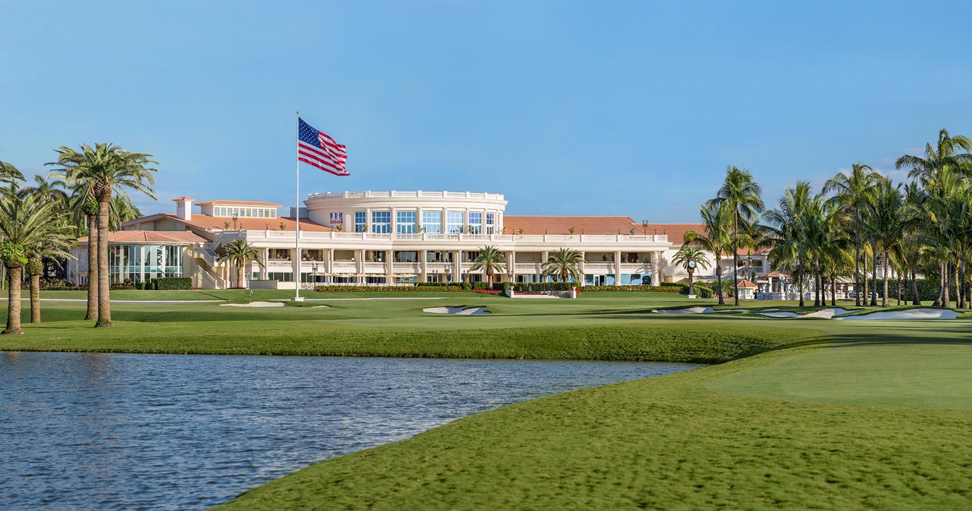 American flag swaying over the course with the Trump National Doral clubhouse looking over