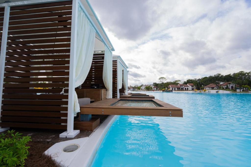 Luxurious cabanas placed over a pool at the Villas of Grand Cypress-Evermore Orlando