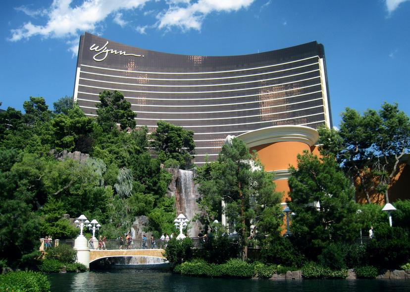 The Wynn Las Vegas hotel building towering over the surrounding trees