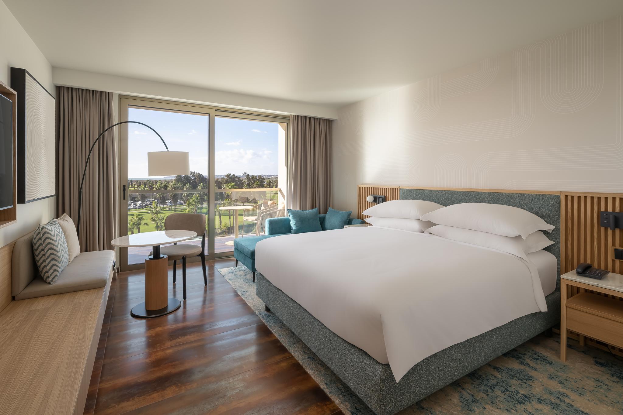 Double bed with a balcony in a double room