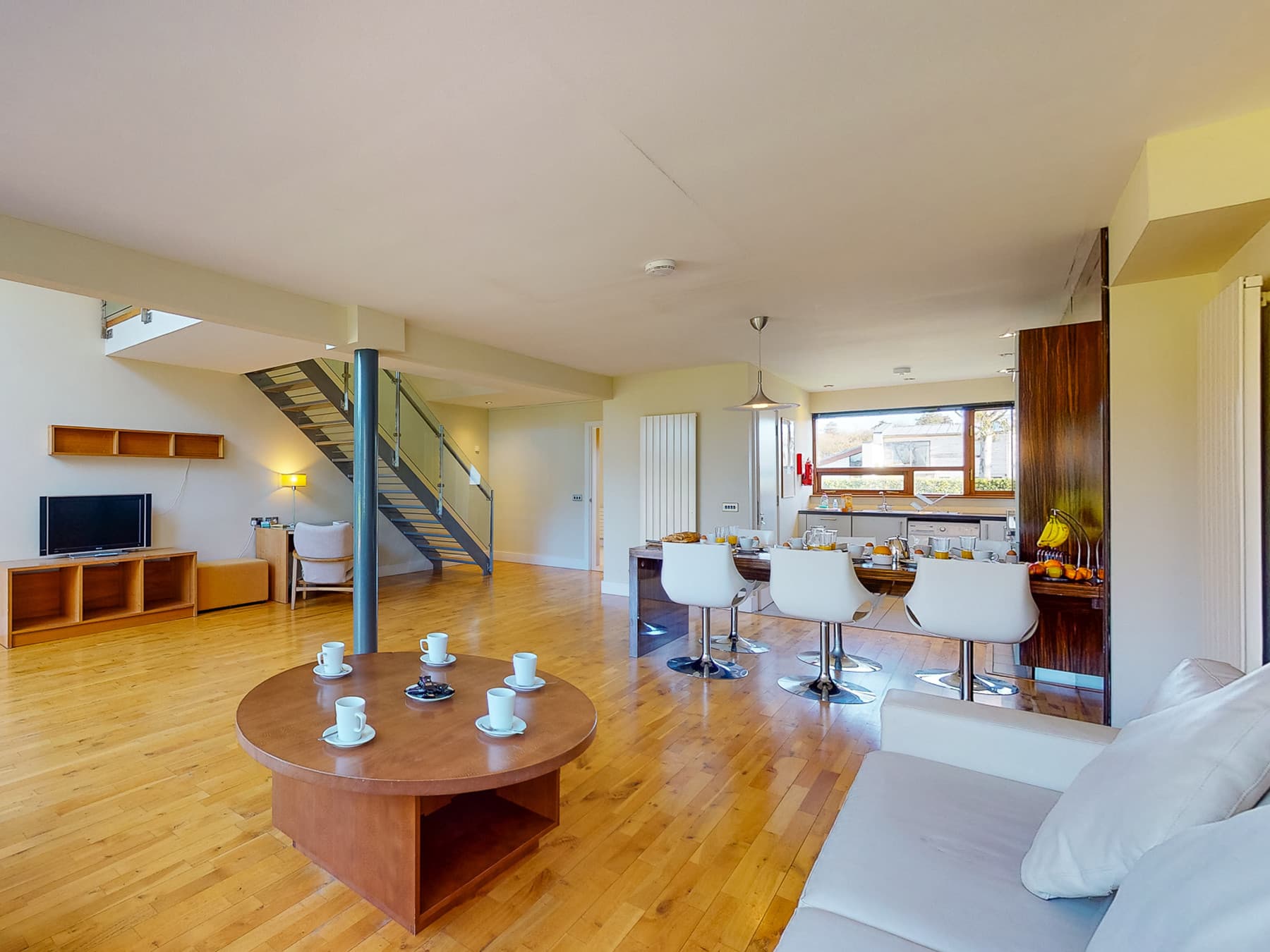 A spacious, modern villa with open-plan living and dining, designed for comfort and relaxation.