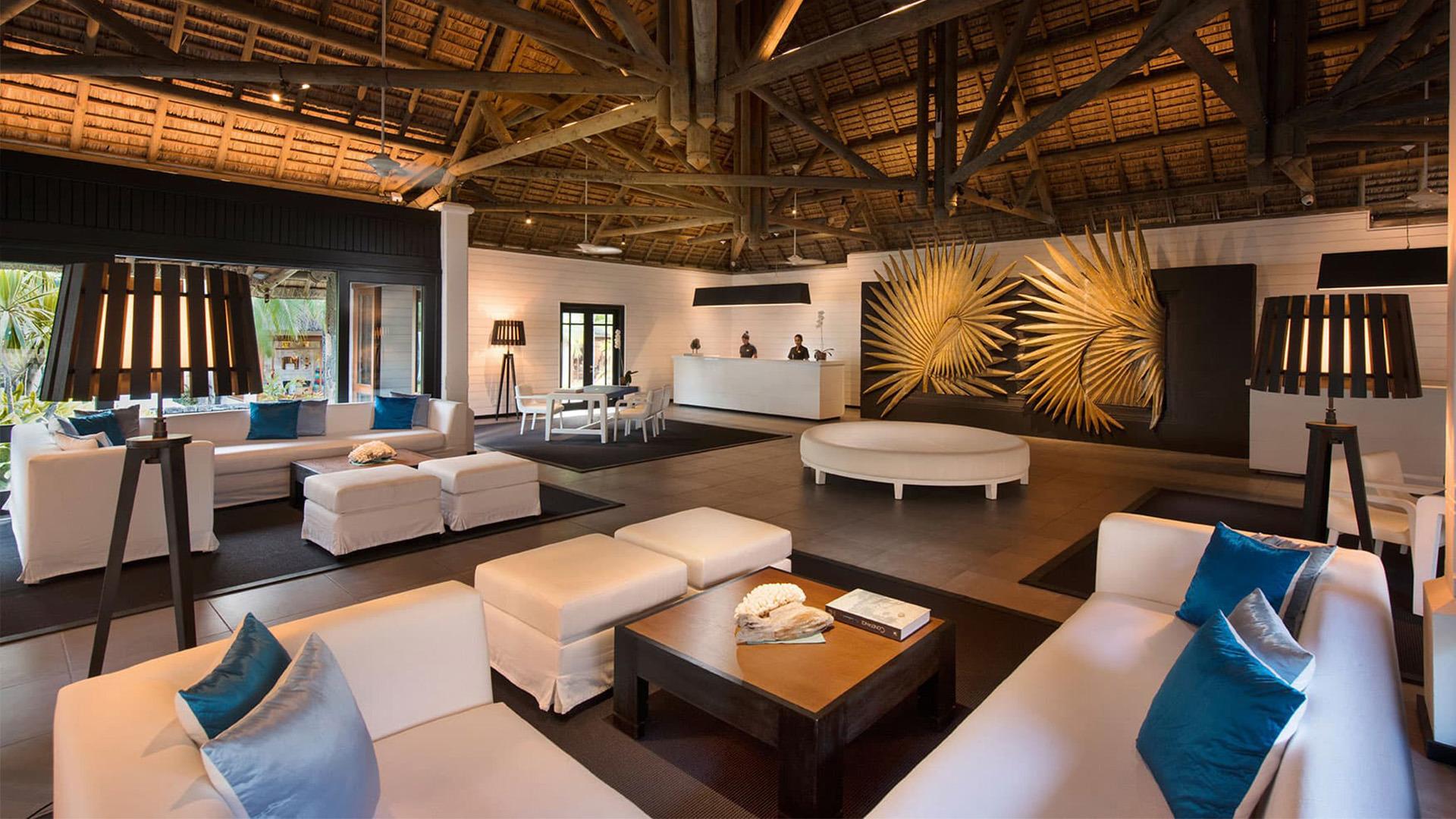 A modern reception at the resort a lounging area and artwork on the wall