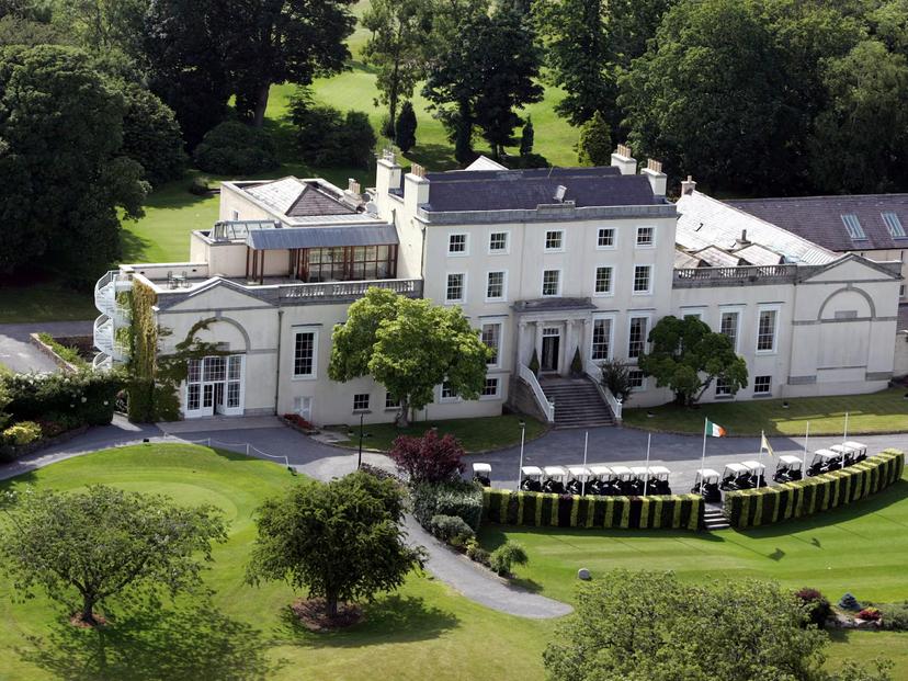 Classic resort building surrounded by lush gardens.