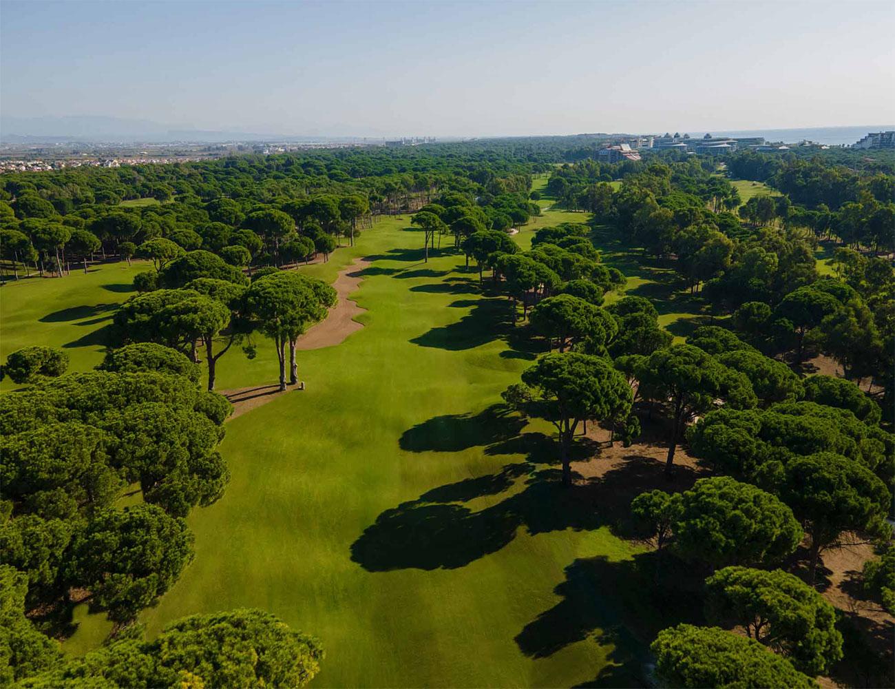 Aerial view of the tree-lined fairways of the Dunes Course at Sueno Golf Club