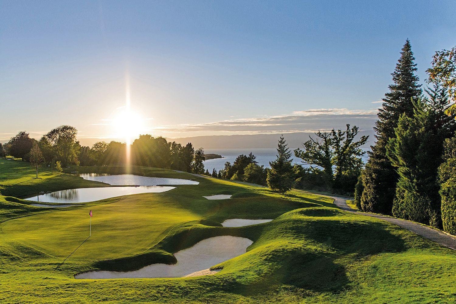 Undulating green with bunkers and water around
