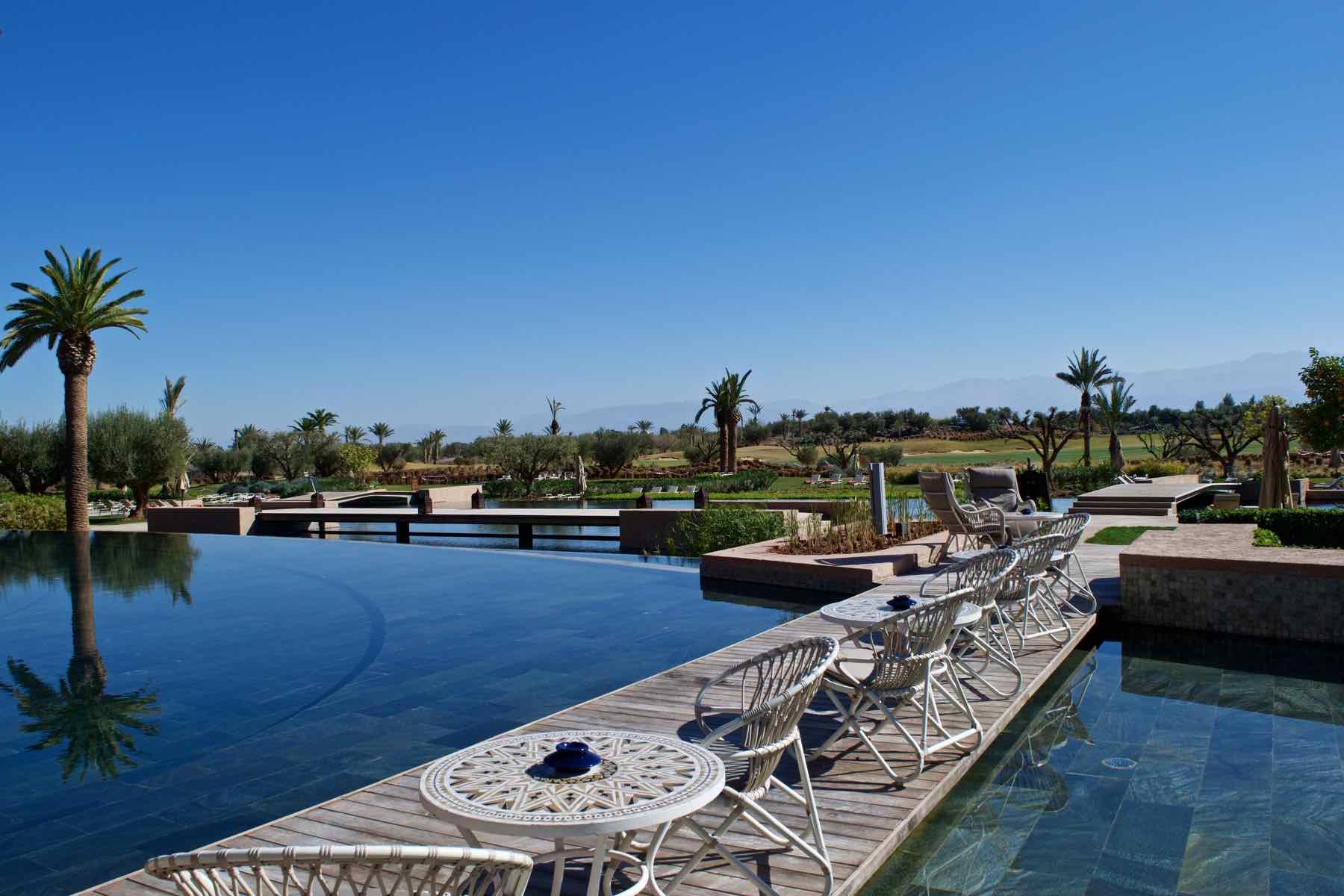 poolside seating on the bridge used to navigate the water feature