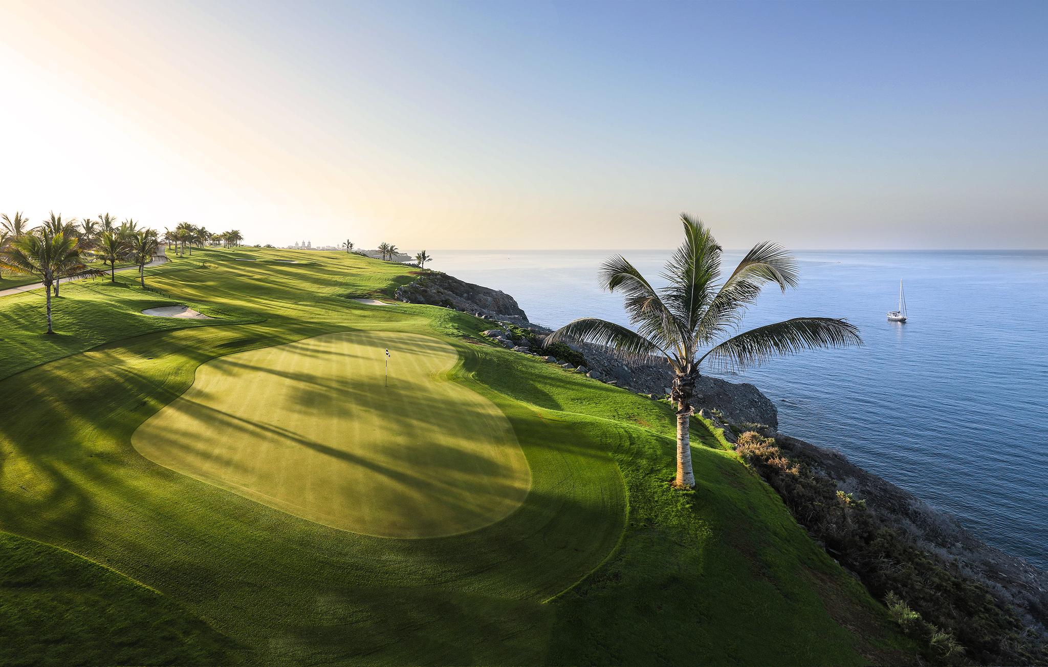 View of one of the cliffside greens on the back 9 at Meloneras Golf