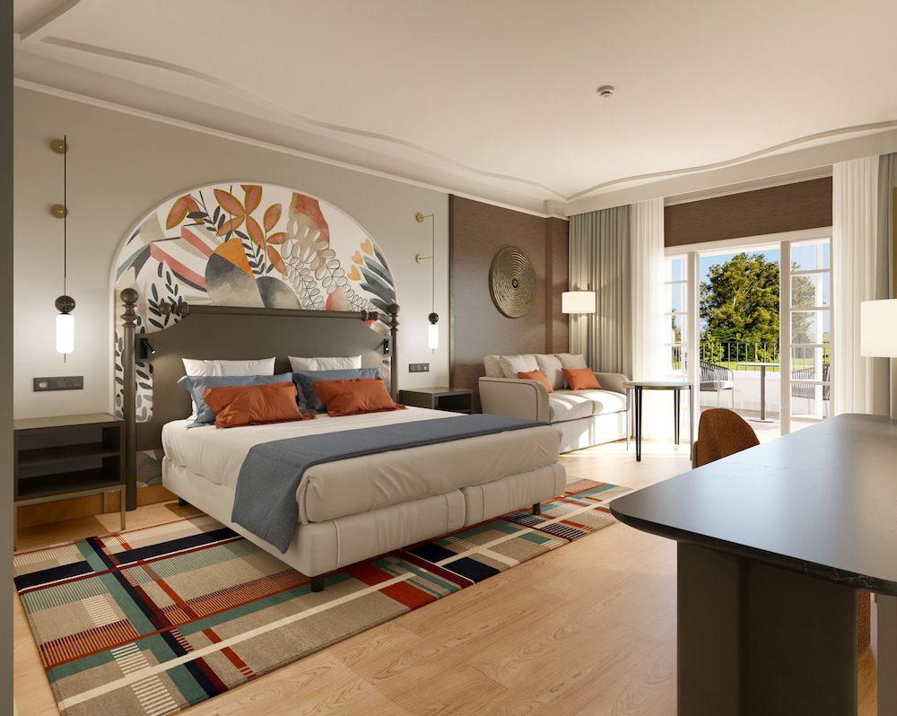 Double bed in a room with a balcony