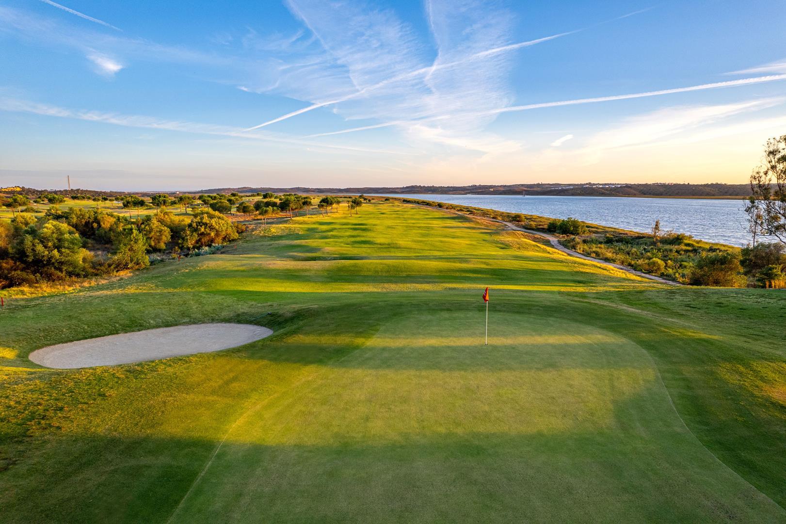 Undulating fairway with water up one side