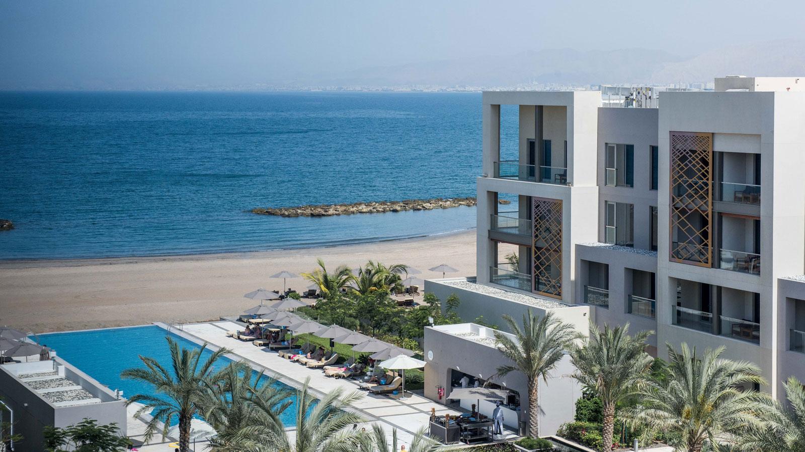 Overhead view of the outdoor swimming pool with views of the beach