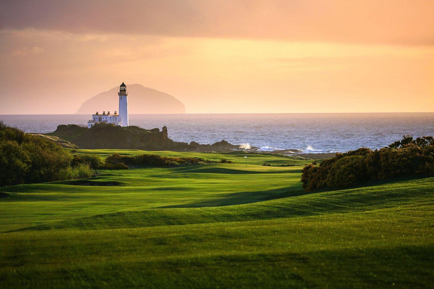 Winding fairways and hilly landscape at sun set