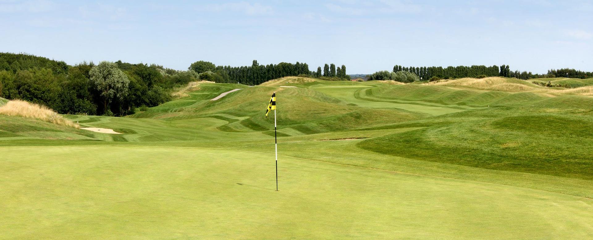 Narrow, winding fairway leading to the green