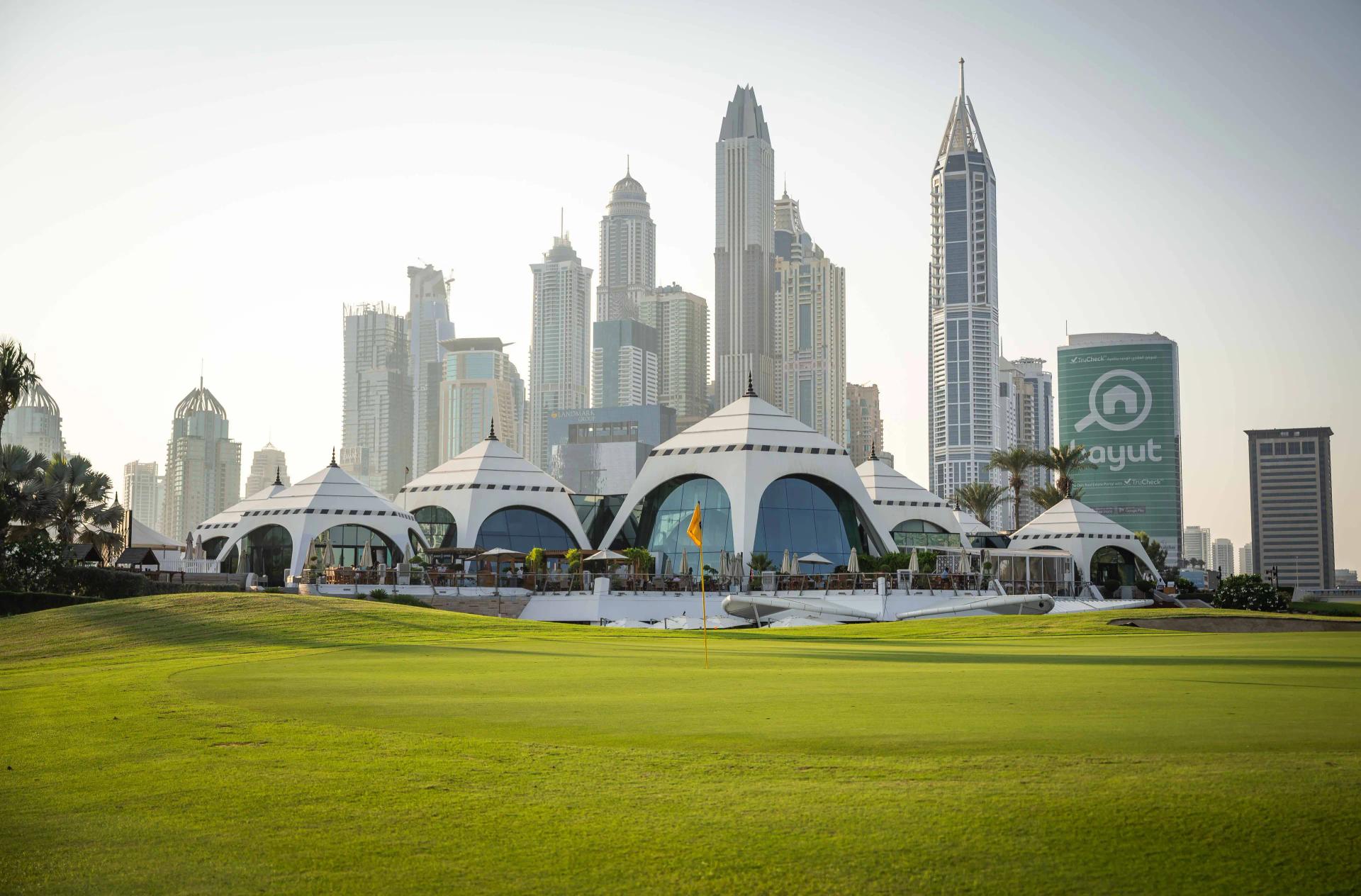 The Dubai city skyline overlooking the Majilis Course at Emirates Golf Club