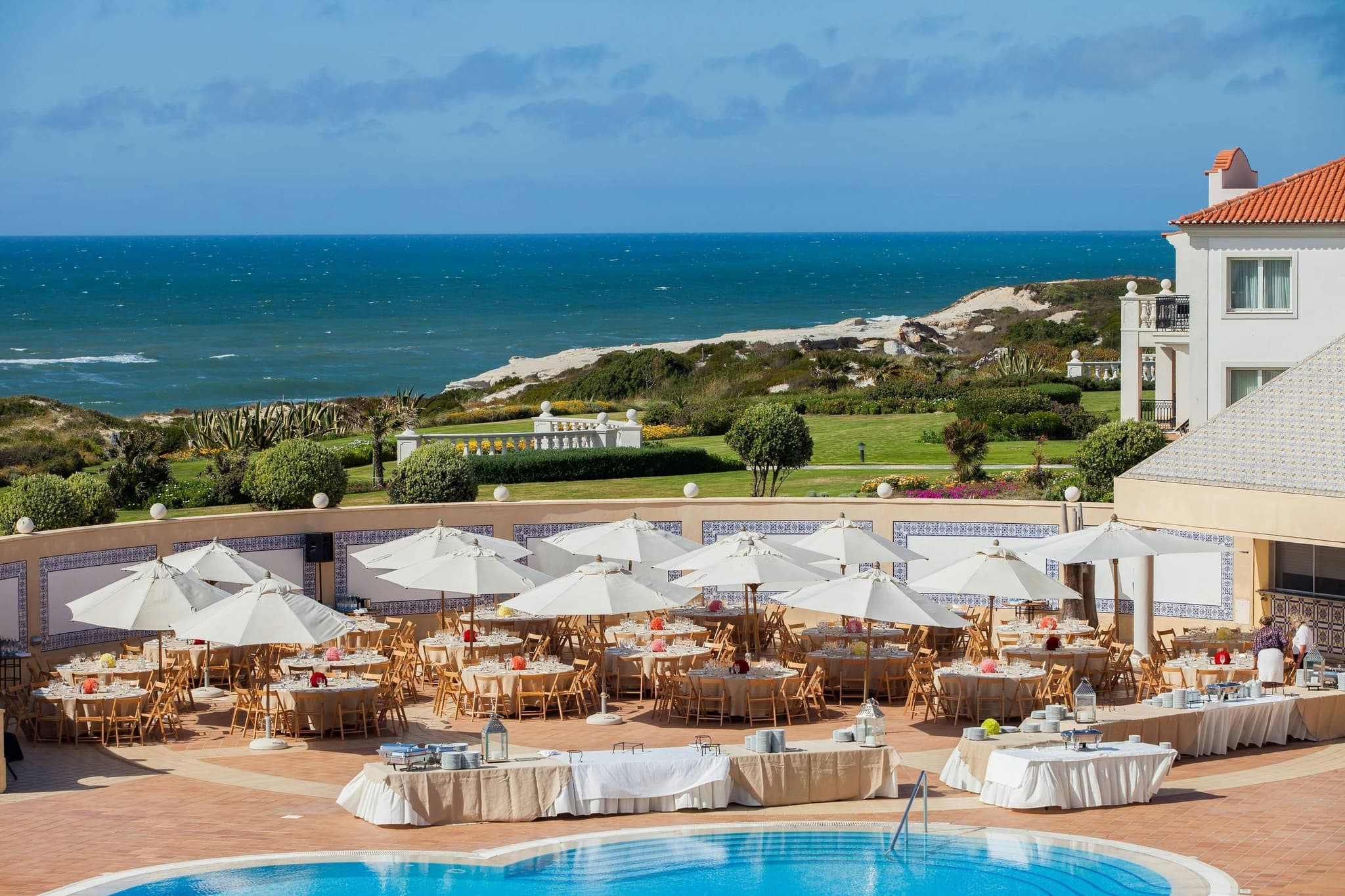 Outdoor swimming pool area and dining area