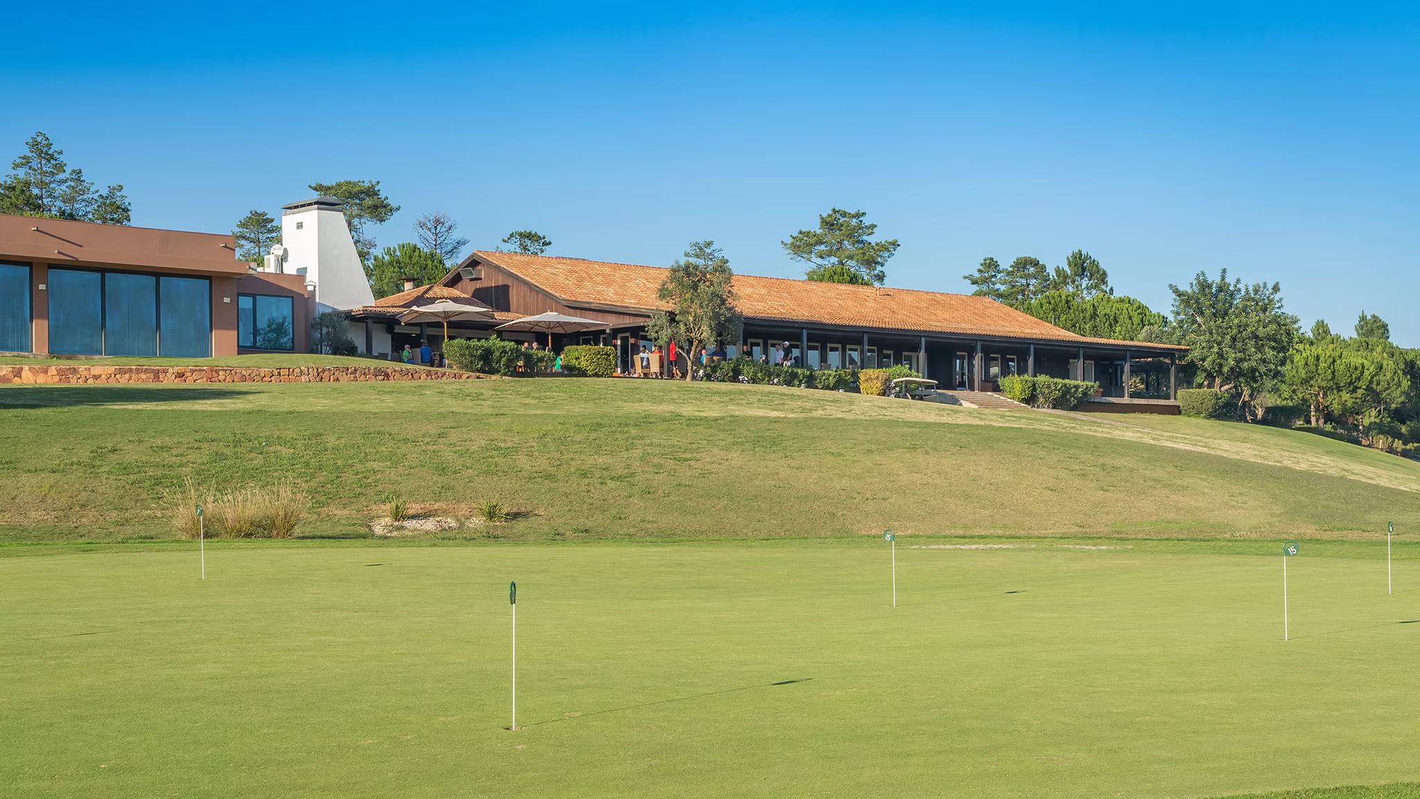 Putting green with the clubhouse in the background