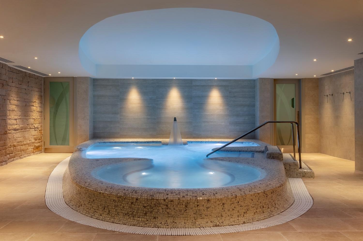 A luxurious spa pool with modern lighting, perfect for relaxing after a day on the course.