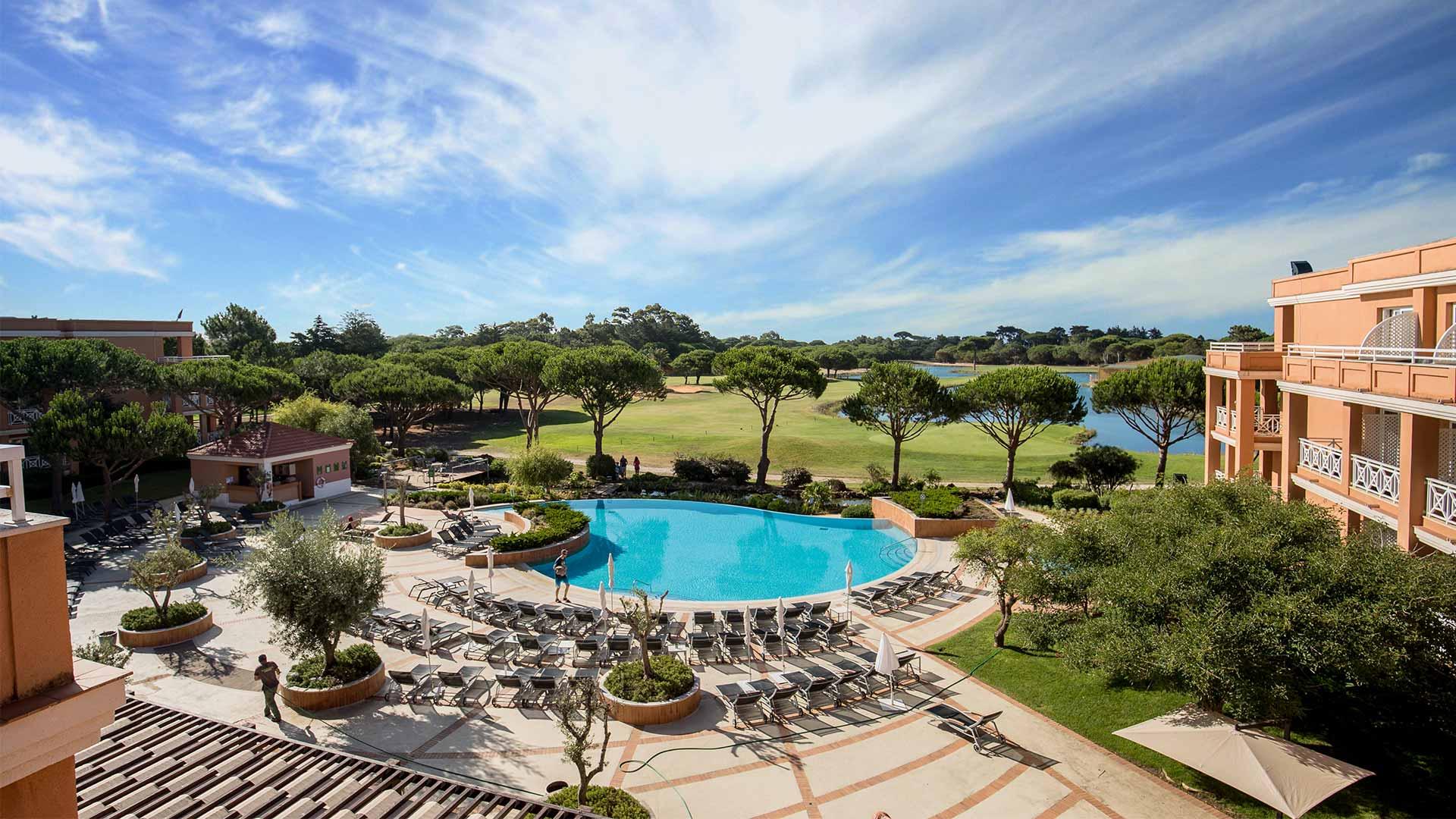 Outdoor swimming pool and lounge area of the Onyria Quinta da Marinha Hotel