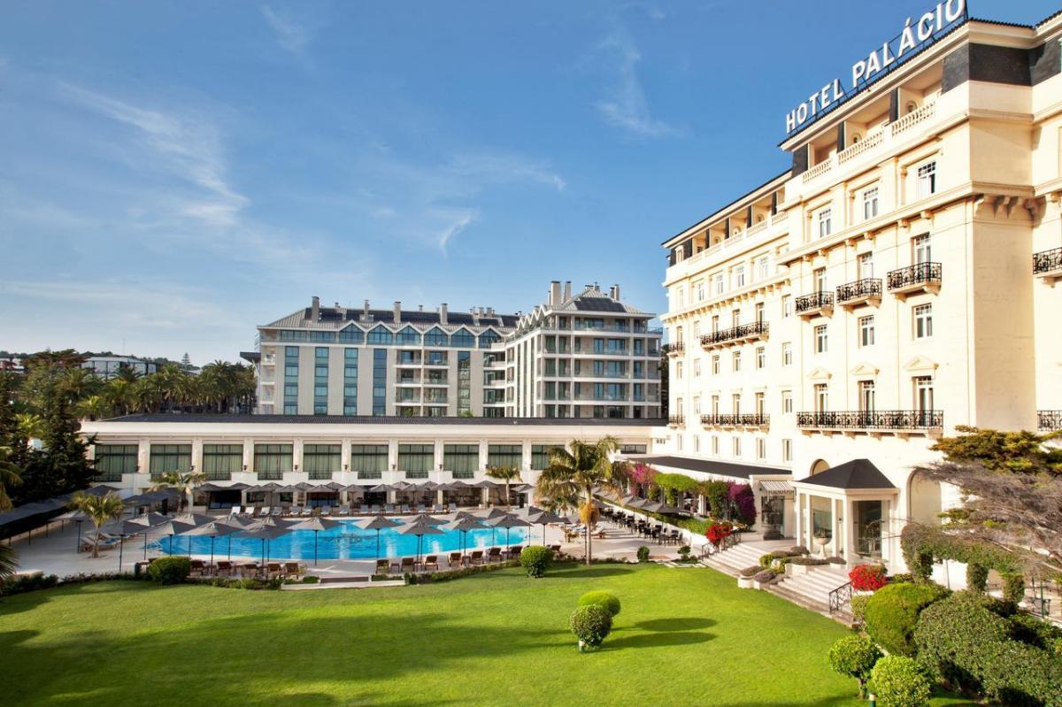 Outdoor swimming pool overlooked by the hotel