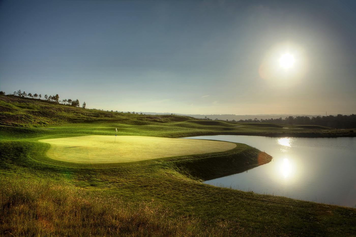 Green with large water hazard in front at Royal Obidos Golf Course
