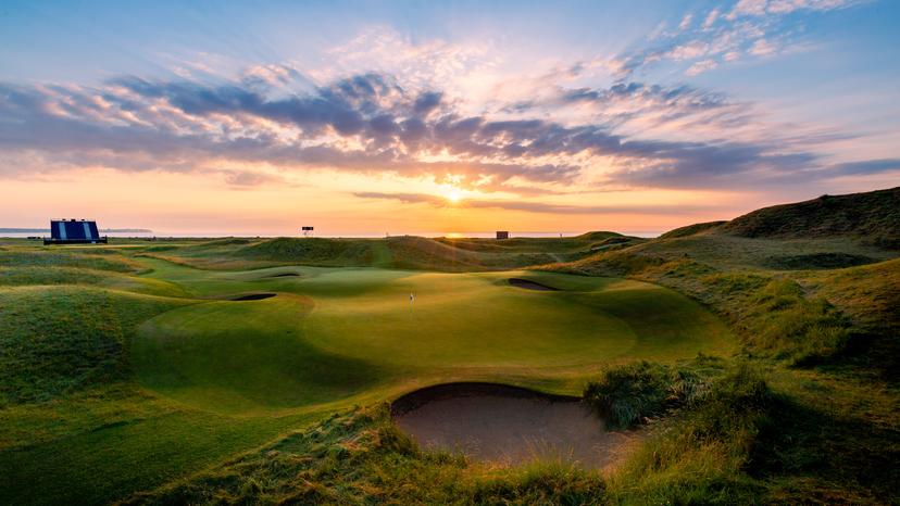 The Royal St Georges course at sunset with coastal views in the distance