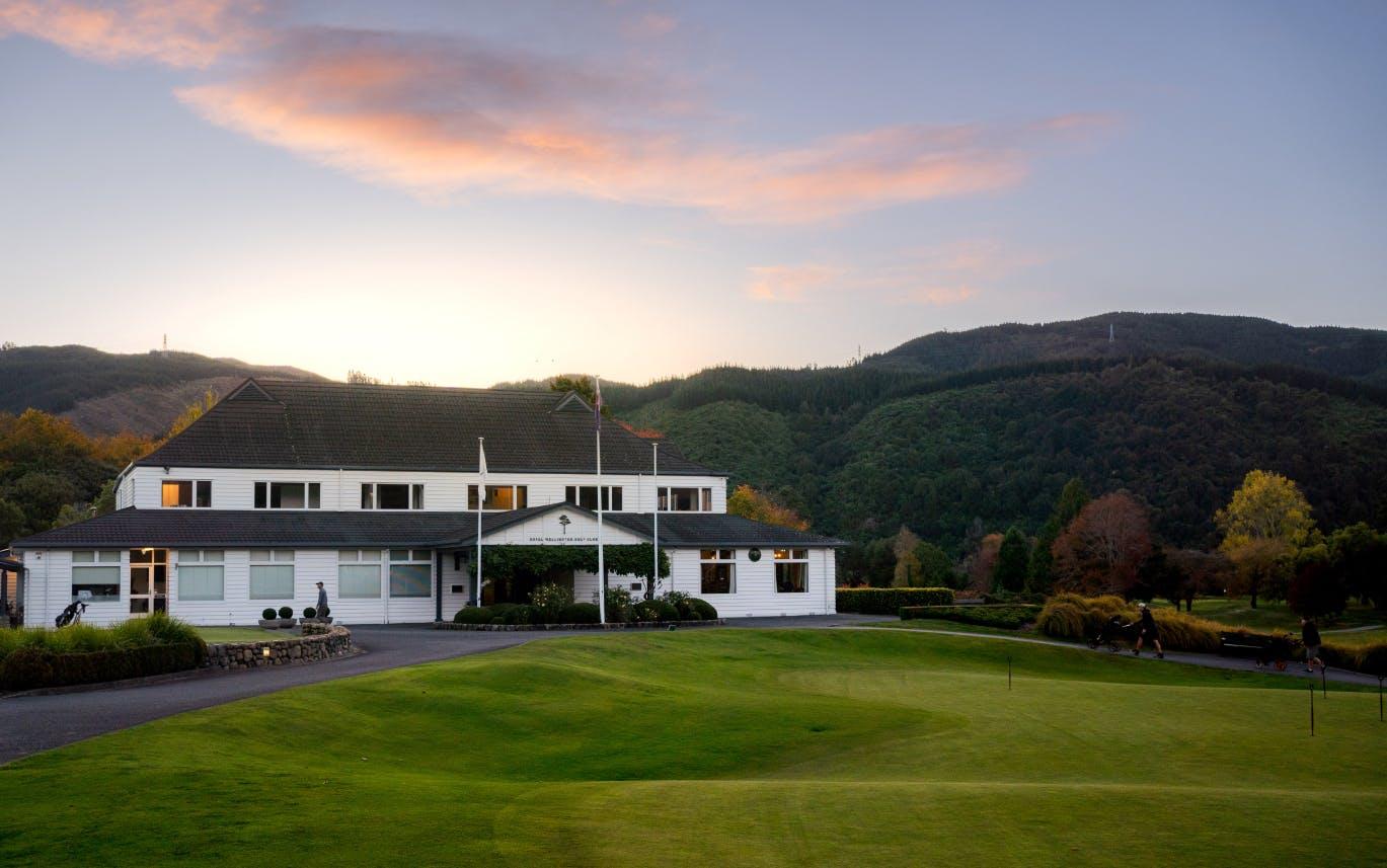 The Royal Wellington Golf Clubhouse overlooking a practice green on the course