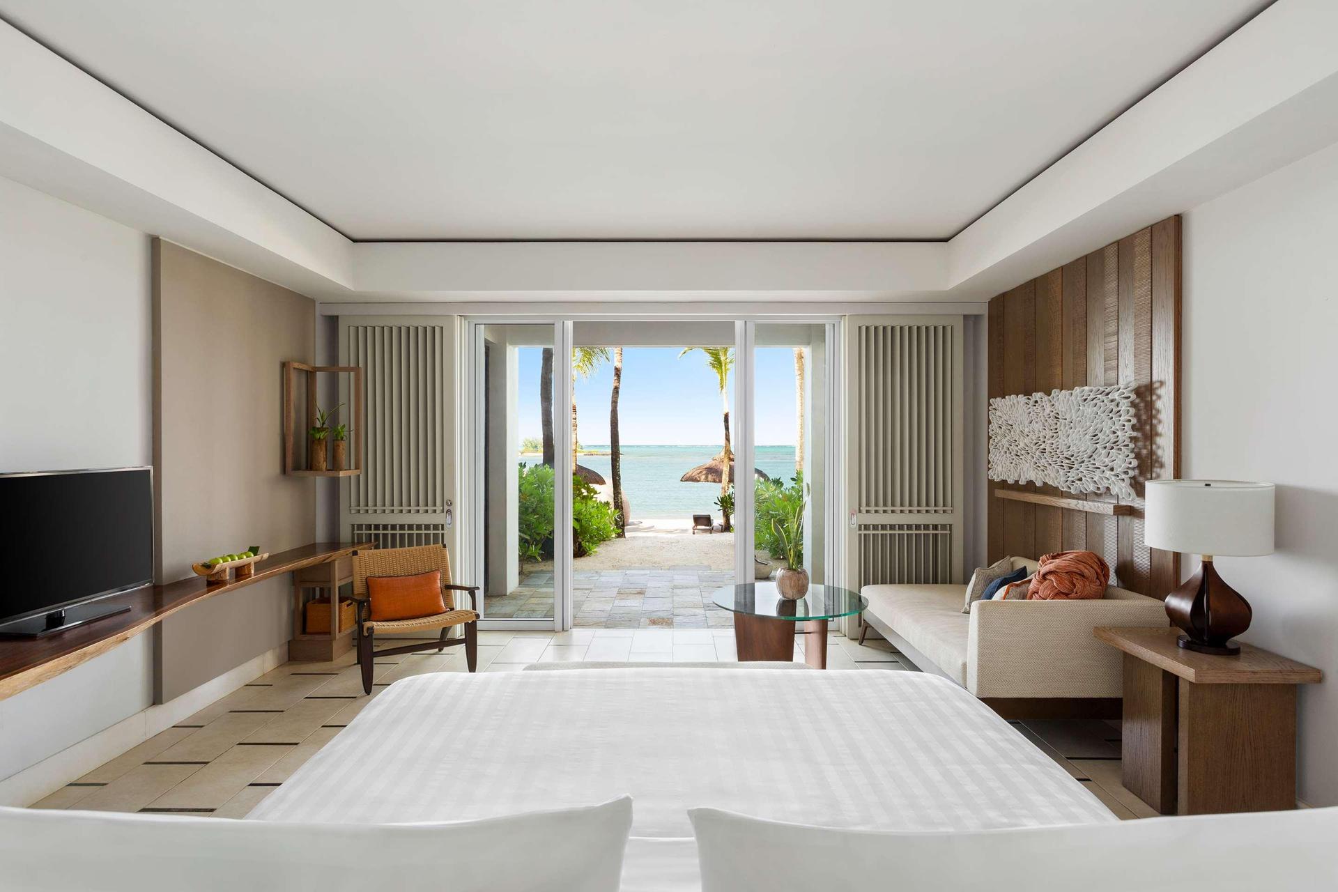 Double bed suite at the resort with a patio leading to the beach