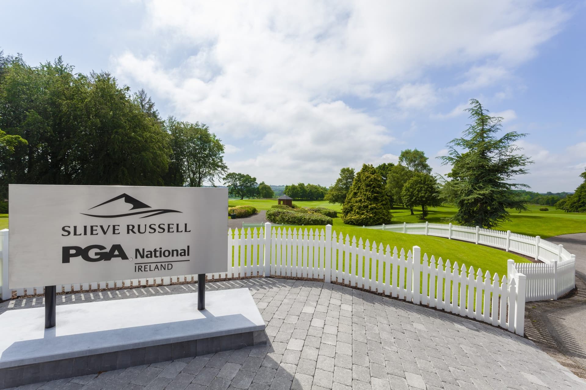 A sign which reads PGA National Ireland for you to see first thing once you walk onto the golf course with fences to direct you