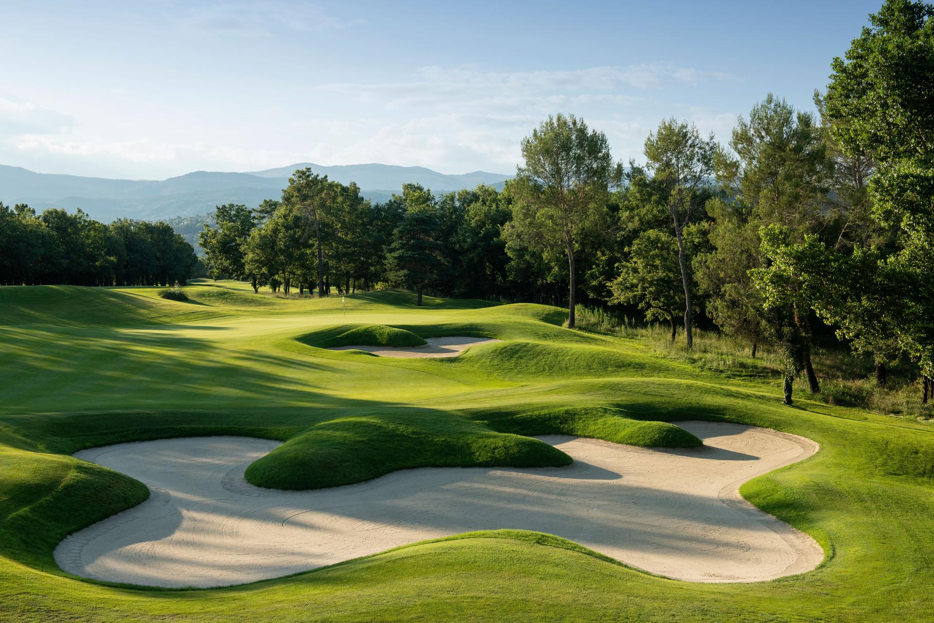 Narrow fairway punctuated by large bunkers