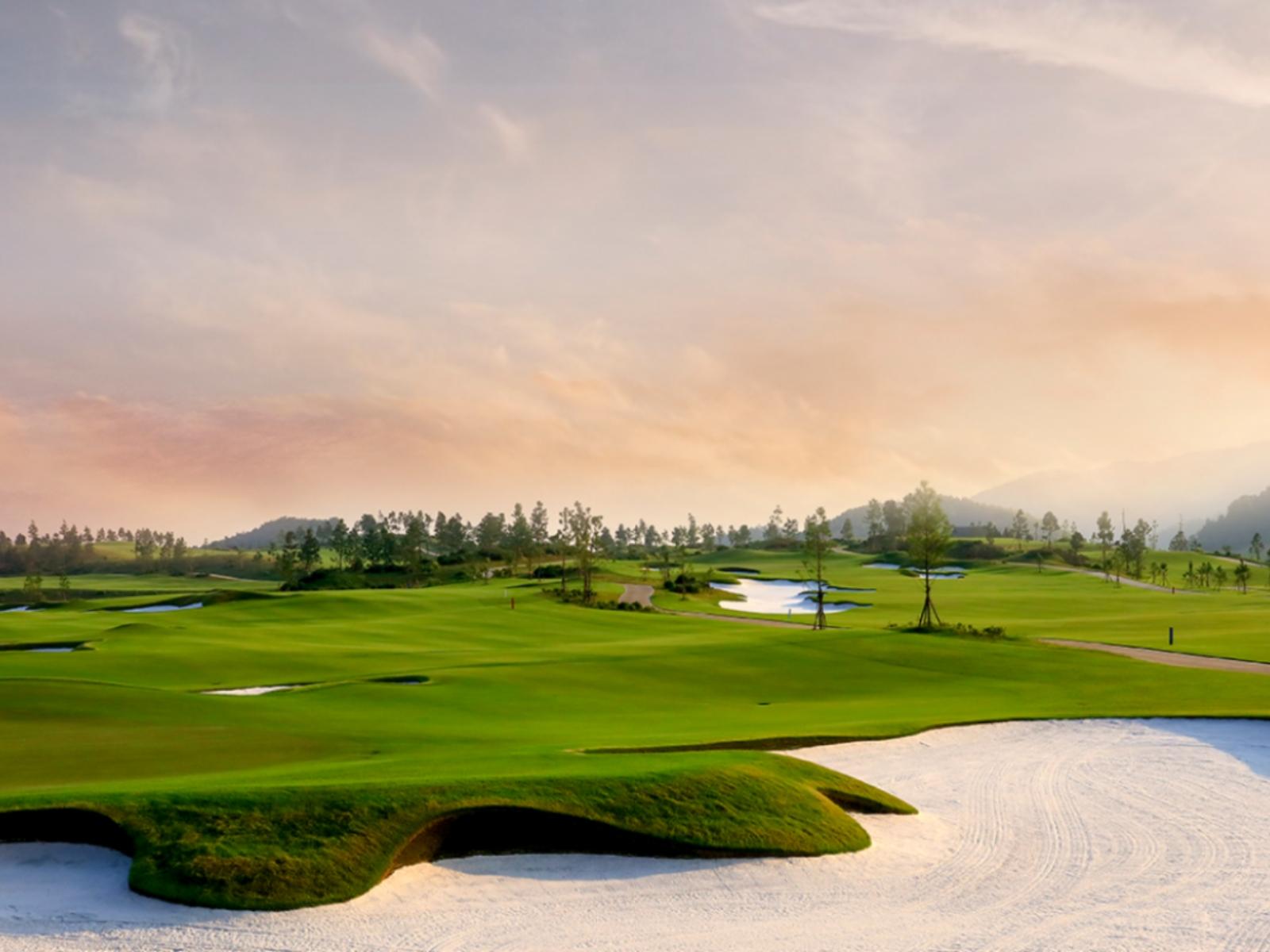 Rolling fairway with a large bunker in the foreground