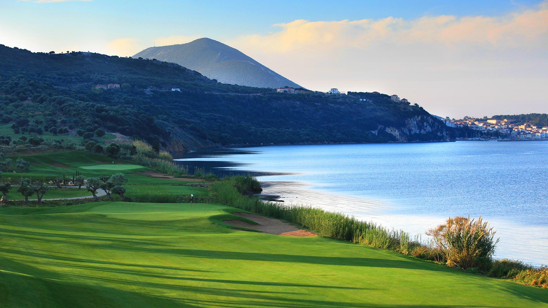 A smooth green placed along the coast with a strategically placed bunker