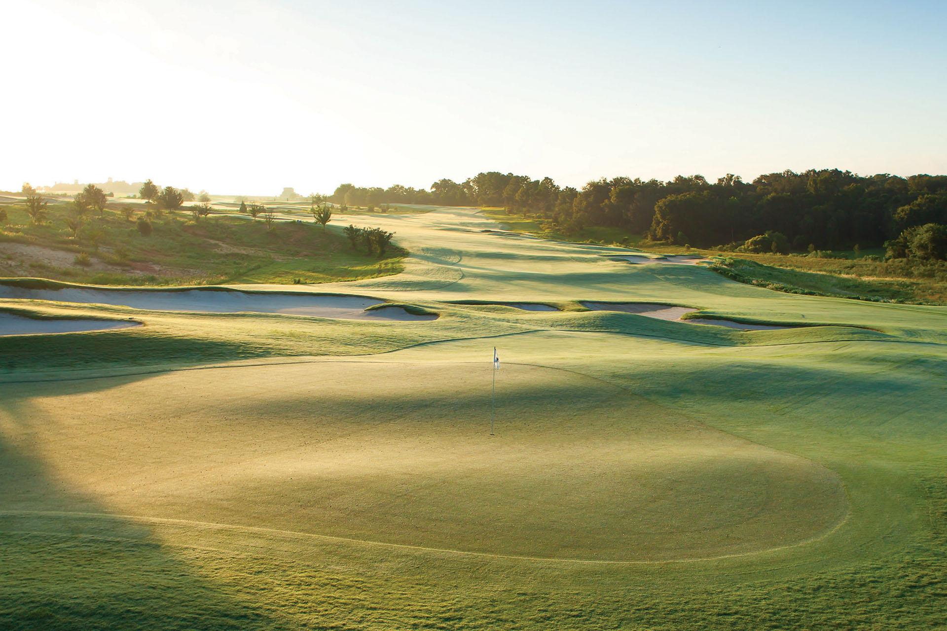 A wide fairway leading to a smooth green