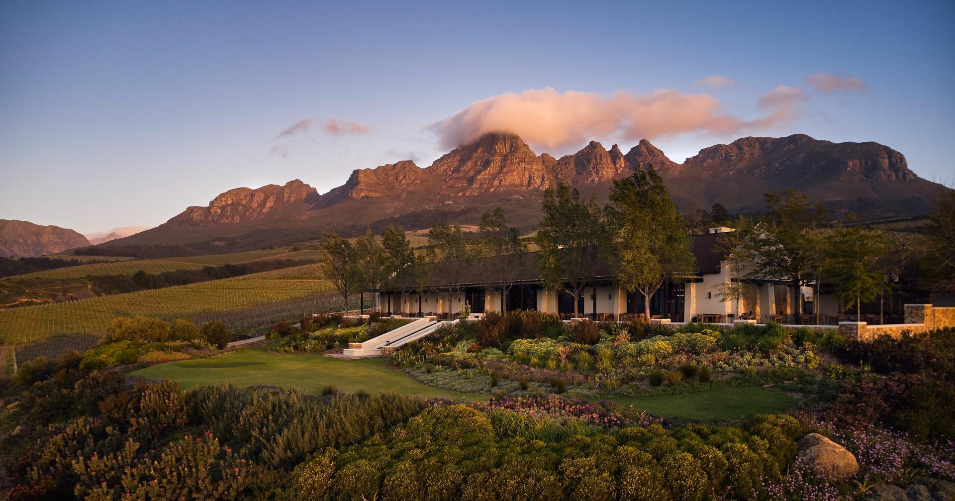 Storehouse at Ernie Els' winery with mountains in the background