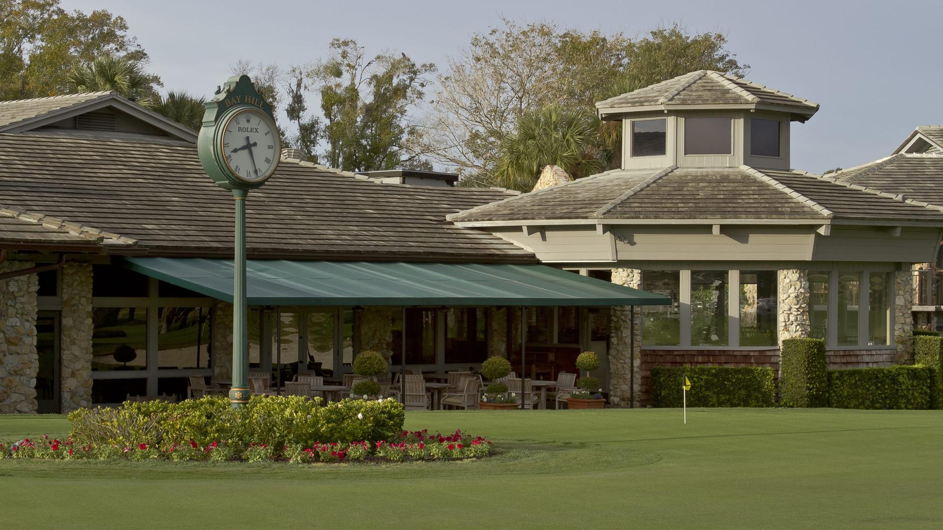 The clubhouse with a Rolex clock tower outside of the building