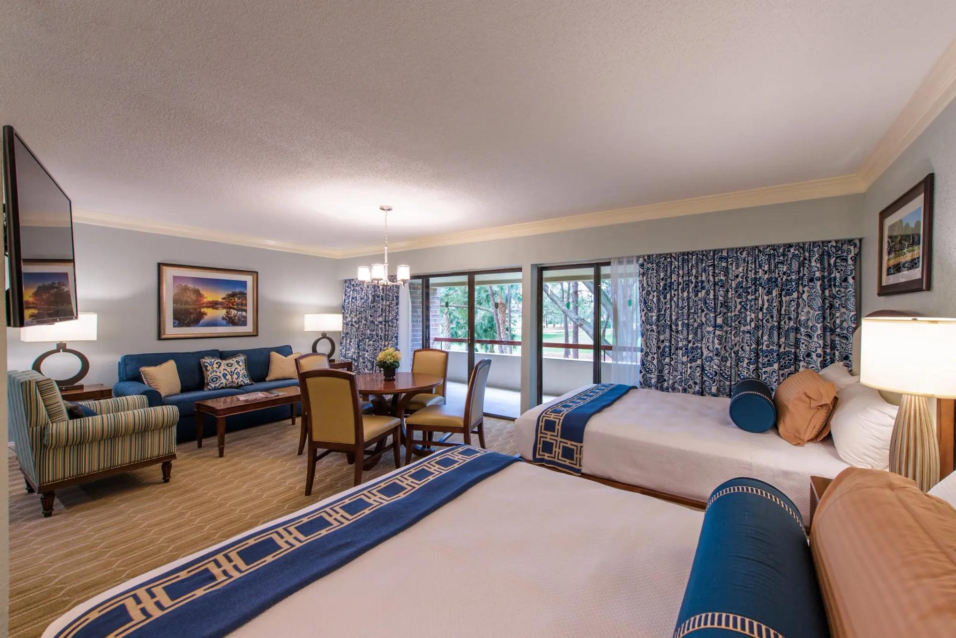 A twin double bed suite at the Innisbrook Resort with a balcony and lounging area