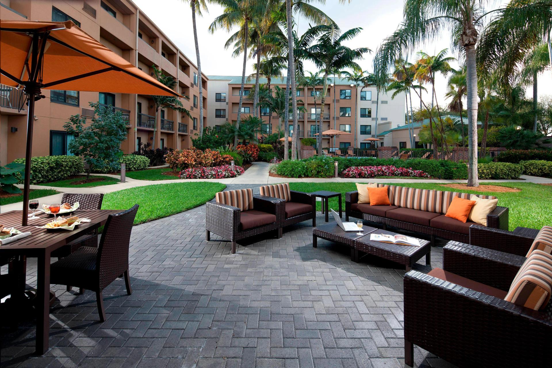Outside area with benches at Miami Lakes Hotel