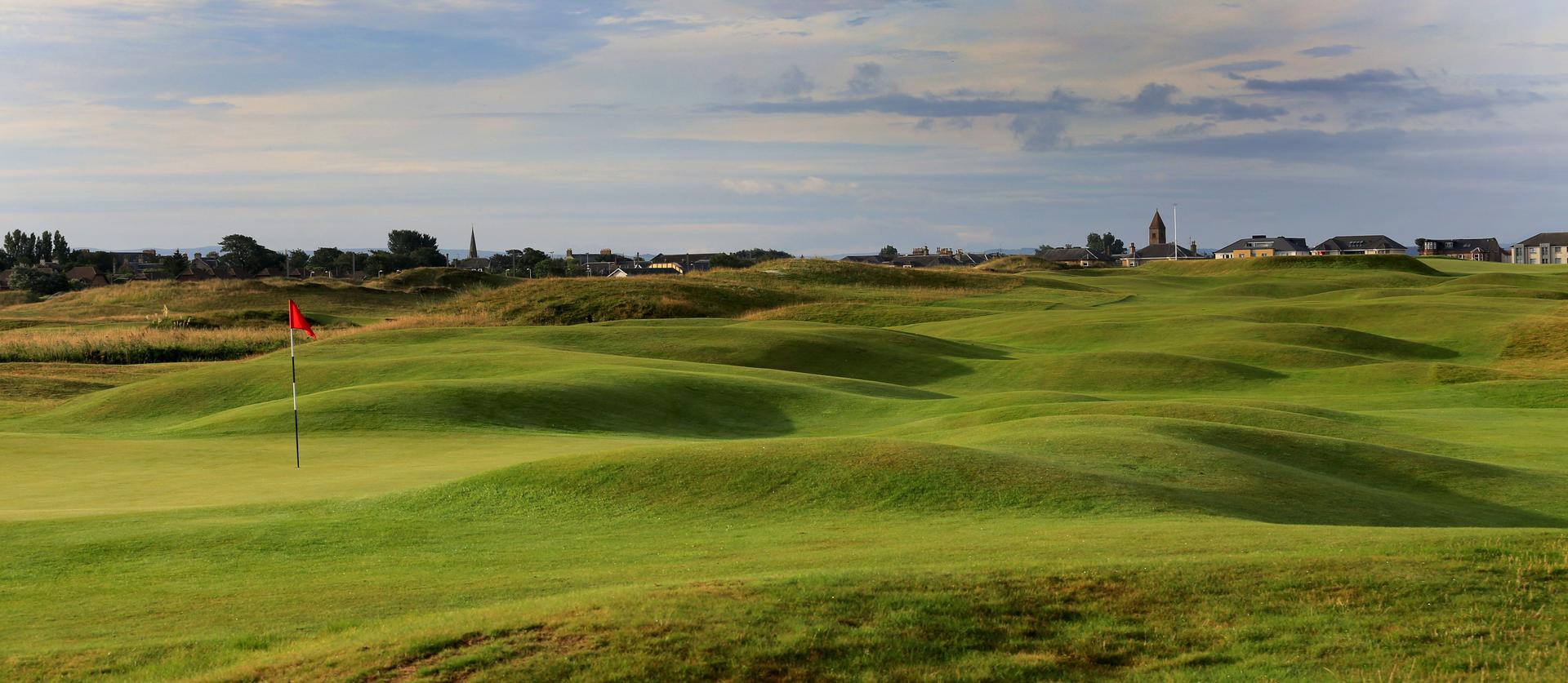 Undulating fairway leading to a green at Prestwick Golf Club