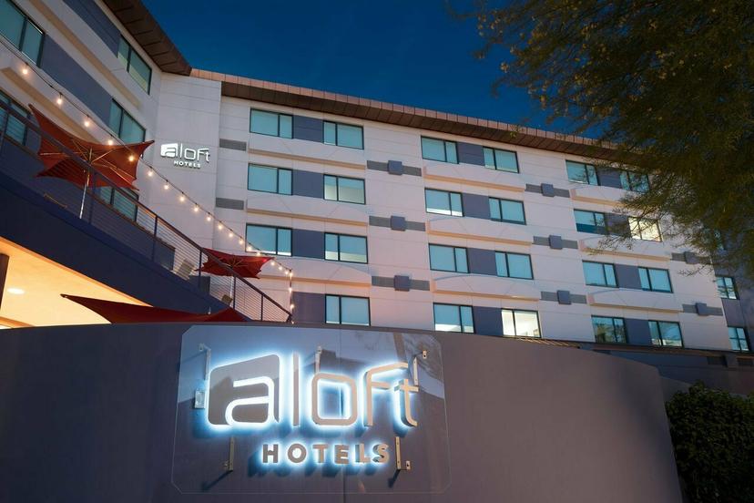 The Aloft sign lit up by LED lights