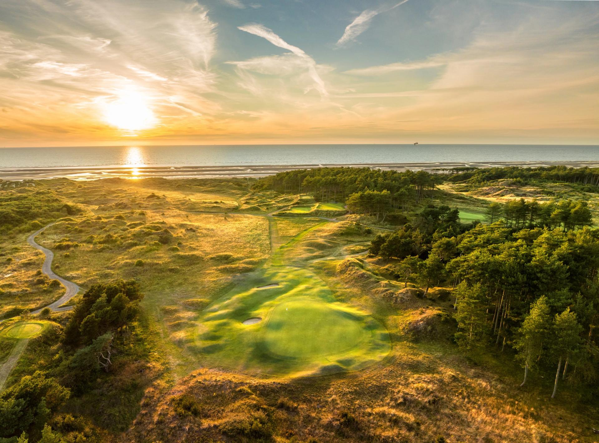 Overhead view of the sun shining over the course