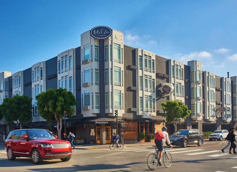 Exterior view of the hotel on he corner of a busy road