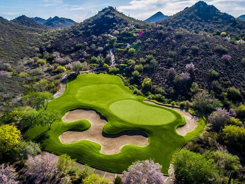 Overhead view of a smooth green next to a sand bunker