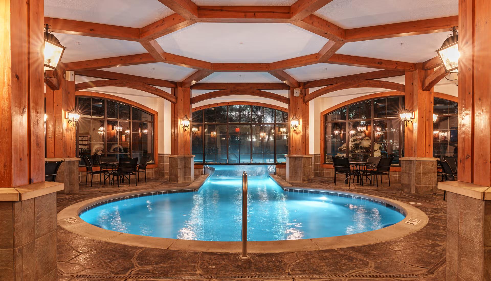 Indoor swimming pool at the resort leading out to an outdoor swimming pool