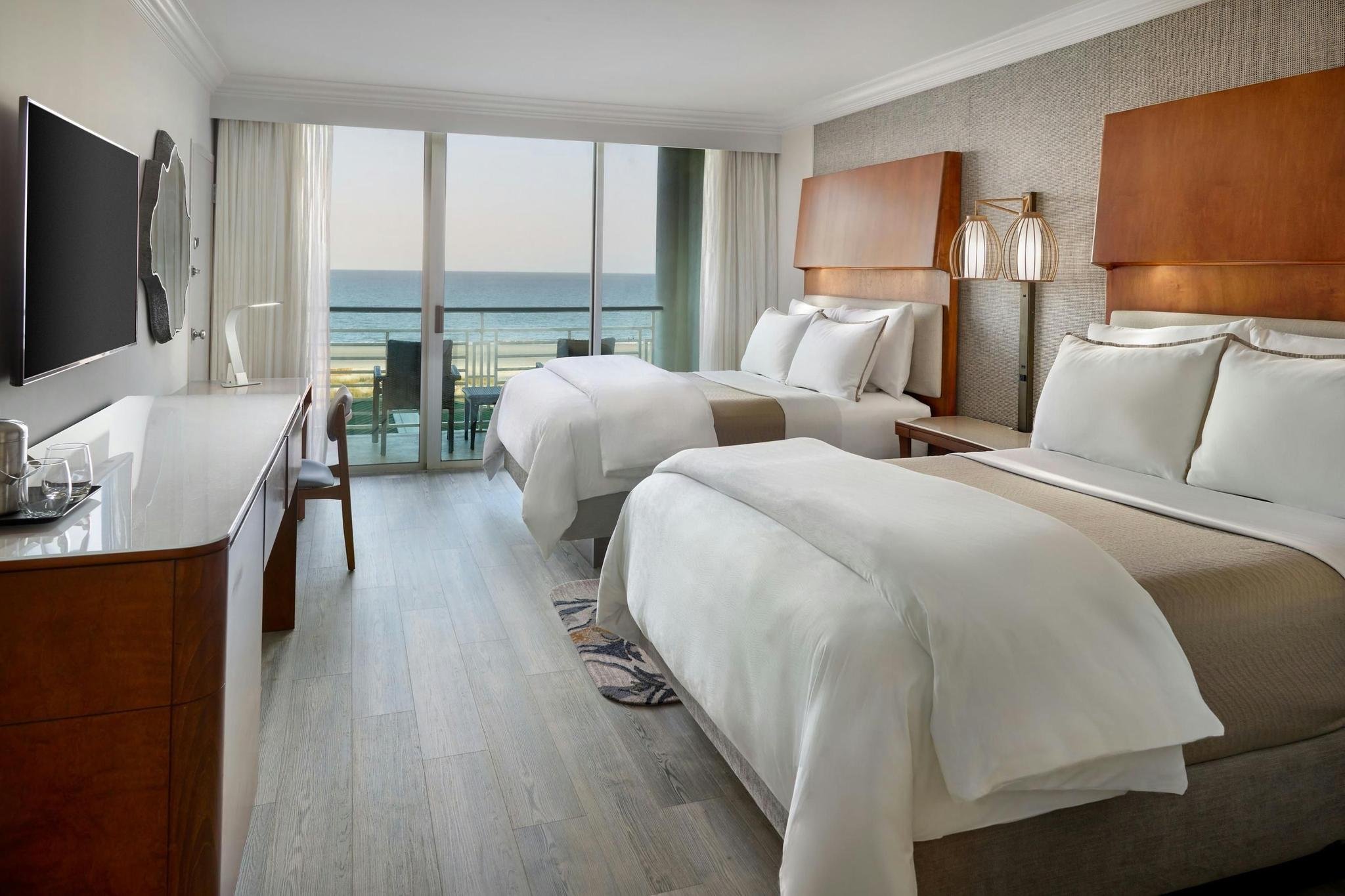 Twin double bed room with balcony views