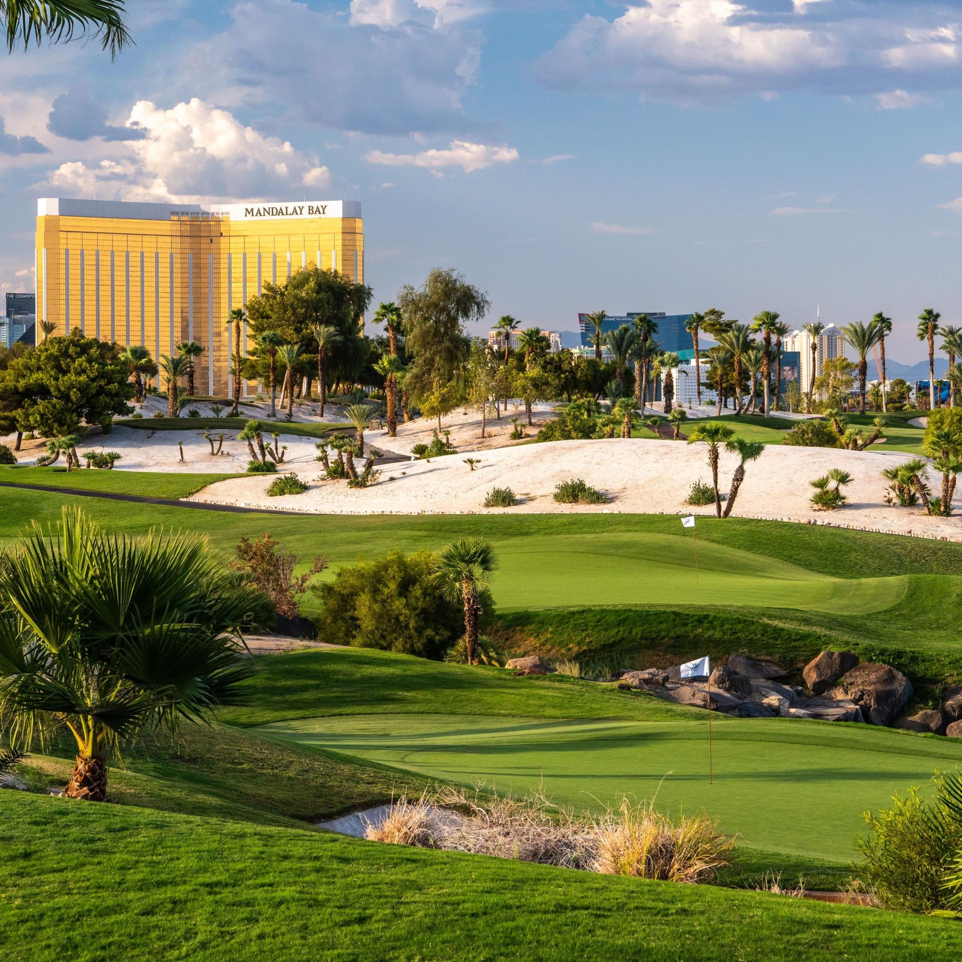Panoramic view of the Bali Hai Golf Club’s course with its rolling dunes surrounded by palm trees on the sandy rough
